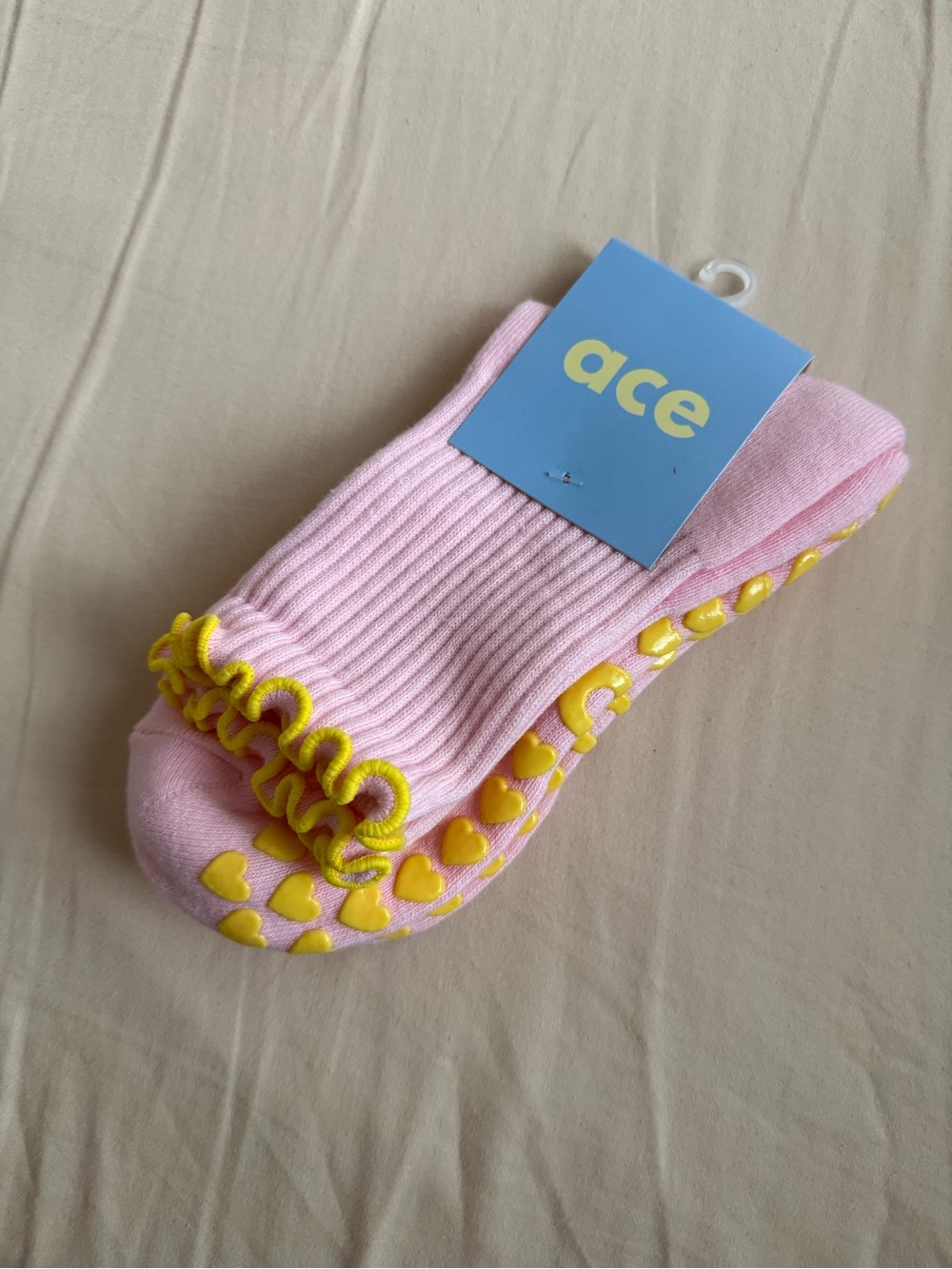 Pink Ruffle Ankle Socks with Yellow Heart Grips